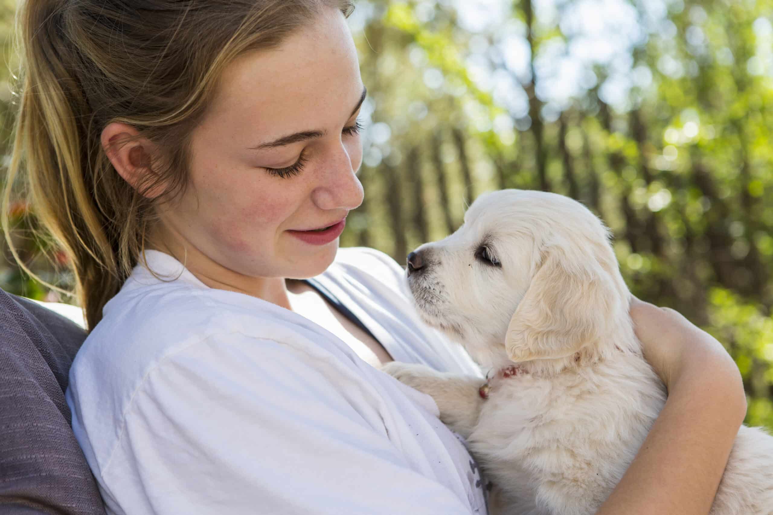 girl holding puppy- blog